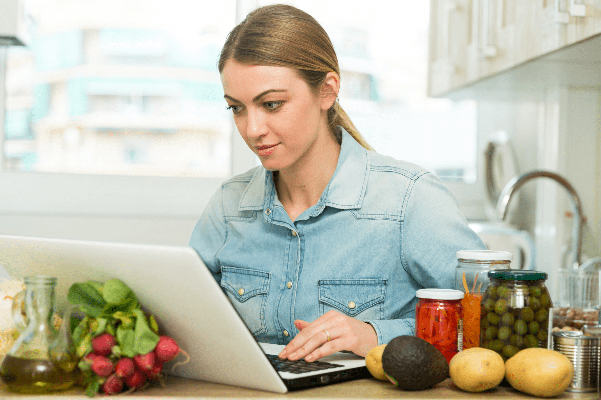 _Easy To Use A woman surrounded by food using a laptop